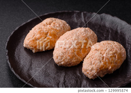 Steamed fish or chicken cutlets or meatballs with salt and spices. Fish cutlets Steamed fish or chicken cutlets or meatballs with salt and spices. Fish cutlets 129995874