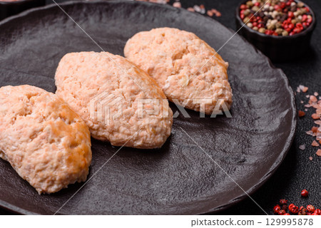 Steamed fish or chicken cutlets or meatballs with salt and spices. Fish cutlets Steamed fish or chicken cutlets or meatballs with salt and spices. Fish cutlets 129995878