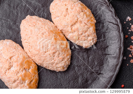 Steamed fish or chicken cutlets or meatballs with salt and spices. Fish cutlets 129995879