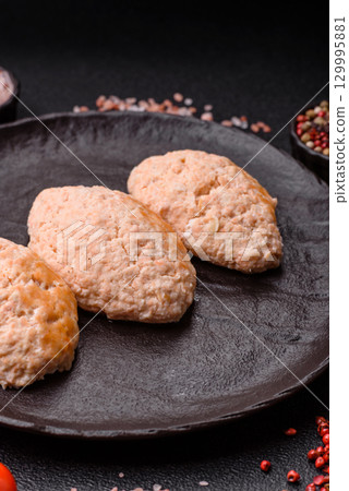 Steamed fish or chicken cutlets or meatballs with salt and spices. Fish cutlets Steamed fish or chicken cutlets or meatballs with salt and spices. Fish cutlets 129995881