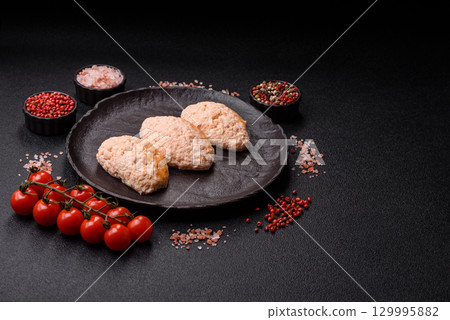 Steamed fish or chicken cutlets or meatballs with salt and spices. Fish cutlets Steamed fish or chicken cutlets or meatballs with salt and spices. Fish cutlets 129995882