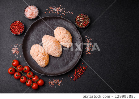 Steamed fish or chicken cutlets or meatballs with salt and spices. Fish cutlets Steamed fish or chicken cutlets or meatballs with salt and spices. Fish cutlets 129995883