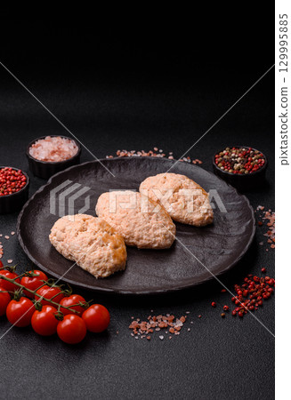 Steamed fish or chicken cutlets or meatballs with salt and spices. Fish cutlets Steamed fish or chicken cutlets or meatballs with salt and spices. Fish cutlets 129995885