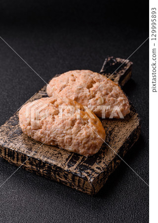 Steamed fish or chicken cutlets or meatballs with salt and spices. Fish cutlets 129995893