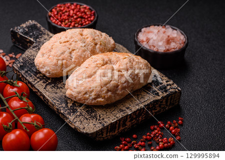 Steamed fish or chicken cutlets or meatballs with salt and spices. Fish cutlets 129995894