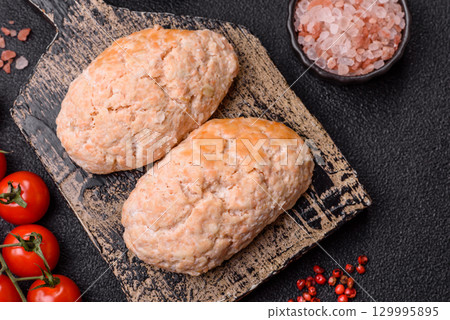 Steamed fish or chicken cutlets or meatballs with salt and spices. Fish cutlets 129995895