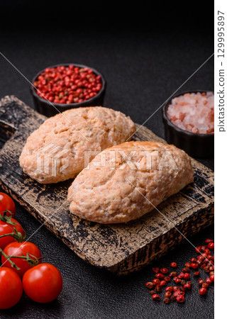 Steamed fish or chicken cutlets or meatballs with salt and spices. Fish cutlets Steamed fish or chicken cutlets or meatballs with salt and spices. Fish cutlets 129995897