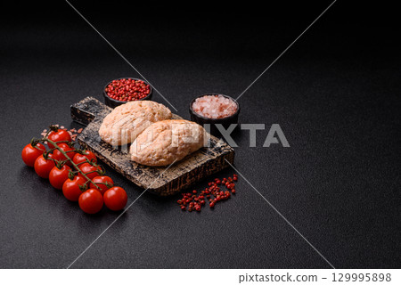 Steamed fish or chicken cutlets or meatballs with salt and spices. Fish cutlets 129995898