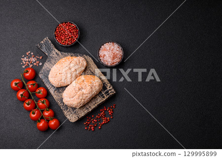 Steamed fish or chicken cutlets or meatballs with salt and spices. Fish cutlets 129995899