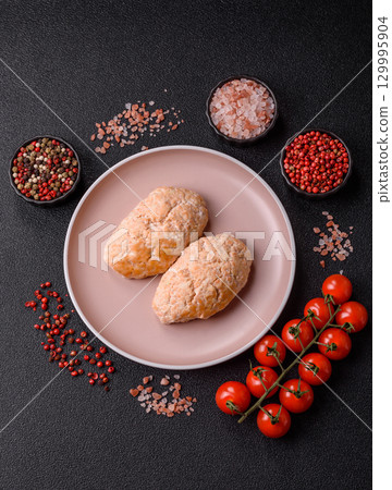 Steamed fish or chicken cutlets or meatballs with salt and spices. Fish cutlets 129995904