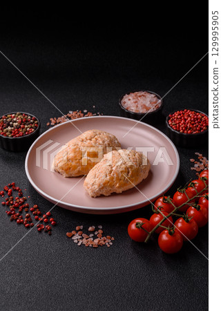 Steamed fish or chicken cutlets or meatballs with salt and spices. Fish cutlets 129995905