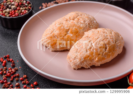Steamed fish or chicken cutlets or meatballs with salt and spices. Fish cutlets 129995906