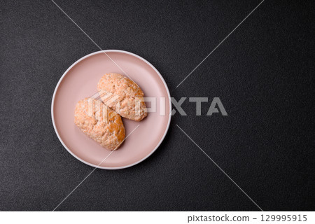 Steamed fish or chicken cutlets or meatballs with salt and spices. Fish cutlets 129995915