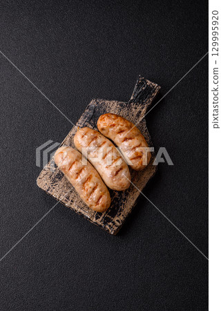 Grilled chicken or beef sausages, a hot meat dish. Barbecued sausages Grilled chicken or beef sausages, a hot meat dish. Barbecued sausages 129995920