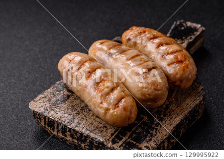 Grilled chicken or beef sausages, a hot meat dish. Barbecued sausages Grilled chicken or beef sausages, a hot meat dish. Barbecued sausages 129995922