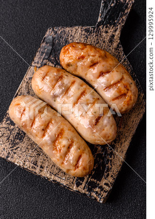 Grilled chicken or beef sausages, a hot meat dish. Barbecued sausages Grilled chicken or beef sausages, a hot meat dish. Barbecued sausages 129995924