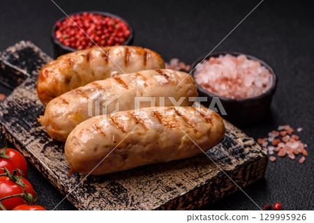 Grilled chicken or beef sausages, a hot meat dish. Barbecued sausages Grilled chicken or beef sausages, a hot meat dish. Barbecued sausages 129995926
