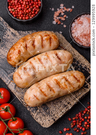 Grilled chicken or beef sausages, a hot meat dish. Barbecued sausages Grilled chicken or beef sausages, a hot meat dish. Barbecued sausages 129995928