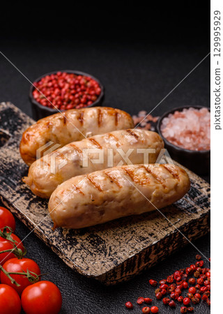 Grilled chicken or beef sausages, a hot meat dish. Barbecued sausages Grilled chicken or beef sausages, a hot meat dish. Barbecued sausages 129995929