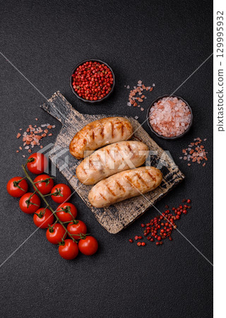 Grilled chicken or beef sausages, a hot meat dish. Barbecued sausages Grilled chicken or beef sausages, a hot meat dish. Barbecued sausages 129995932