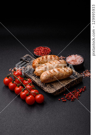 Grilled chicken or beef sausages, a hot meat dish. Barbecued sausages Grilled chicken or beef sausages, a hot meat dish. Barbecued sausages 129995933