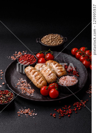 Grilled chicken or beef sausages, a hot meat dish. Barbecued sausages 129995937