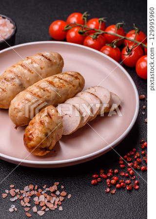 Grilled chicken or beef sausages, a hot meat dish. Barbecued sausages Grilled chicken or beef sausages, a hot meat dish. Barbecued sausages 129995960
