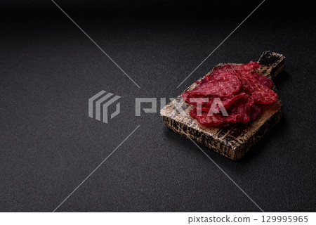 Jerky or dried chicken and cherry snacks. Dehydrated, dried snacks for beer 129995965