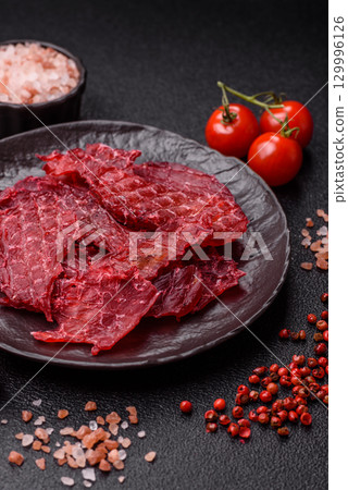 Jerky or dried chicken and cherry snacks. Dehydrated, dried snacks for beer Jerky or dried chicken and cherry snacks. Dehydrated, dried snacks for beer 129996126