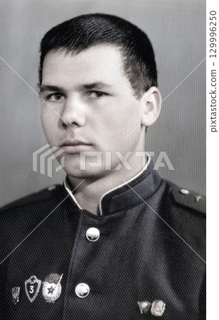 Vintage portrait of a young corporal of the Soviet army. Retro photo 1968 Vintage portrait of a young corporal of the Soviet army. Retro photo 1968 129996250