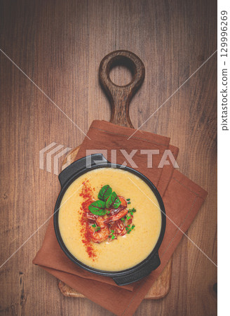 pumpkin cream soup with shrimp, herbs and spices, homemade, no people, 129996269