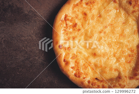 khachapuri in Megrelian, a traditional Georgian dish, flatbread with cheese, top view, no people, khachapuri in Megrelian, a traditional Georgian dish, flatbread with cheese, top view, no people, 129996272