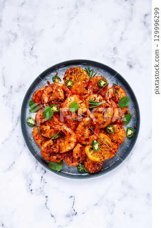 grilled shrimp, unpeeled, headless, with spices, on a marble table, homemade, no people, grilled shrimp, unpeeled, headless, with spices, on a marble table, homemade, no people, 129996299