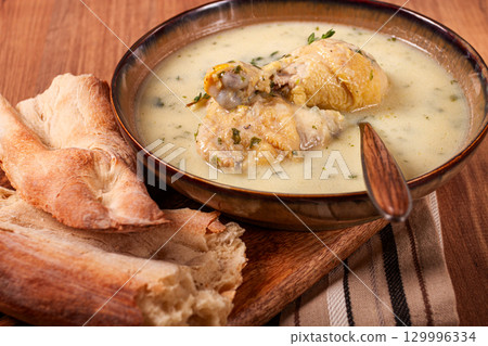 Chikhirtma chicken soup, Georgian dish, with lavash, top view, no people, Chikhirtma chicken soup, Georgian dish, with lavash, top view, no people, 129996334
