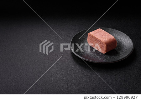 Food, meat, ham sliced in slices for the festive table. Spiced ham 129996927