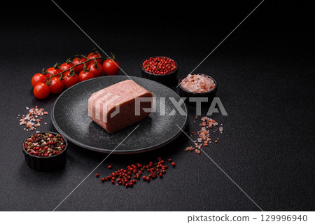 Food, meat, ham sliced in slices for the festive table. Spiced ham 129996940