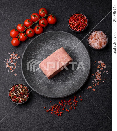 Food, meat, ham sliced in slices for the festive table. Spiced ham 129996942