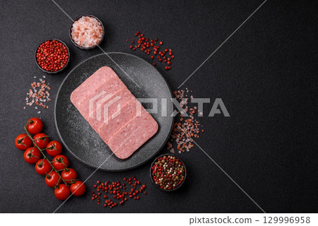 Food, meat, ham sliced in slices for the festive table. Spiced ham 129996958