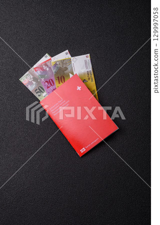 Swiss passport for travelling, flying and doing business. Switzerland document Swiss passport for travelling, flying and doing business. Switzerland document 129997058