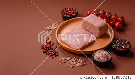 Food, meat, ham sliced in slices for the festive table. Spiced ham 129997112