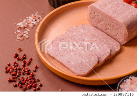 Food, meat, ham sliced in slices for the festive table. Spiced ham Food, meat, ham sliced in slices for the festive table. Spiced ham 129997116