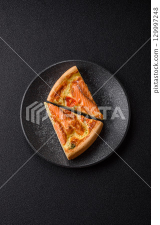 Quiche, salmon pie, broccoli, cheese. Quiche tart with fish and vegetables, cheese 129997248