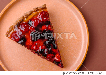 Pie, cheesecake with mascarpone, raspberries and blackberries. Cheesecake with cheese 129997325