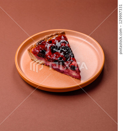 Pie, cheesecake with mascarpone, raspberries and blackberries. Cheesecake with cheese 129997331
