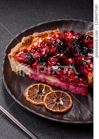 Pie, cheesecake with mascarpone, raspberries and blackberries. Cheesecake with cheese 129997340