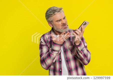 Mature man talk phone call frustration, irritated gesture, conflict mood, negative emotion outburst Mature man talk phone call frustration, irritated gesture, conflict mood, negative emotion outburst 129997399