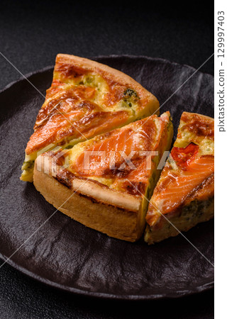 Quiche, salmon pie, broccoli, cheese. Quiche tart with fish and vegetables, cheese Quiche, salmon pie, broccoli, cheese. Quiche tart with fish and vegetables, cheese 129997403
