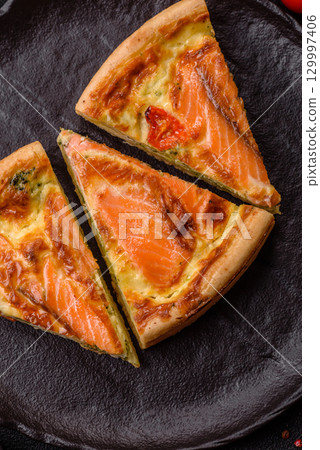 Quiche, salmon pie, broccoli, cheese. Quiche tart with fish and vegetables, cheese Quiche, salmon pie, broccoli, cheese. Quiche tart with fish and vegetables, cheese 129997406