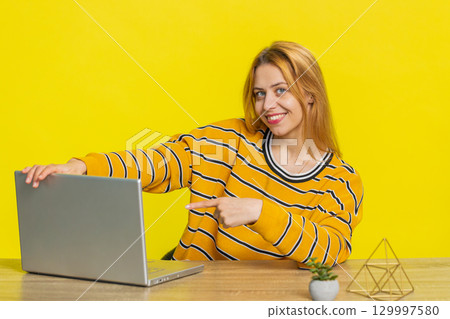 Woman working online on laptop, recommend program application game, positive feedback good offer Woman working online on laptop, recommend program application game, positive feedback good offer 129997580
