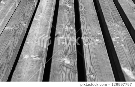 Monochrome texture of wooden boards. Perspective view Monochrome texture of wooden boards. Perspective view 129997797
